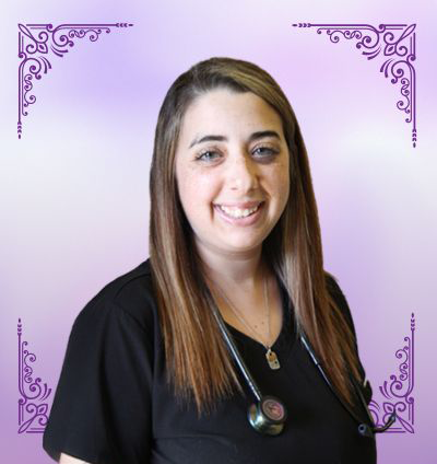 A woman with straight brown hair wearing a black shirt and a stethoscope around her neck stands in front of a purple background with decorative corners.